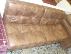 A modern brown leather effect sofa bed,