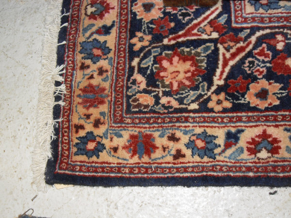 An Eastern rug, the central panel with all over foliate decoration on a midnight blue ground, - Image 9 of 9