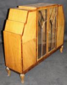 An early 20th Century walnut and cross banded display cabinet with two central astragal glazed