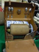 A leather cased picnic box containing various fittings to include vesta case, teaspoons, flask,