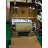 A leather cased picnic box containing various fittings to include vesta case, teaspoons, flask,