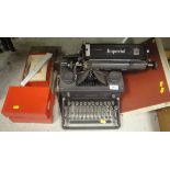 An Imperial 55 manual typewriter, together with two boxes of ribbons, a Victorian photograph album,