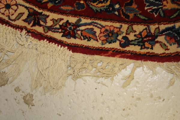 A Persian rug, the central panel set with stylised floral medallion on a red, blue and cream ground, - Image 4 of 34