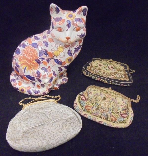 Three early to mid 20th Century evening bags with gilt metal mounts (two tapestry, one silk work),