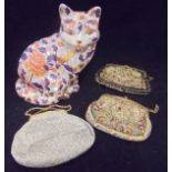 Three early to mid 20th Century evening bags with gilt metal mounts (two tapestry, one silk work),