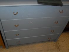 A child's two door wardrobe above three drawers, together with a blue painted chest of four drawers,