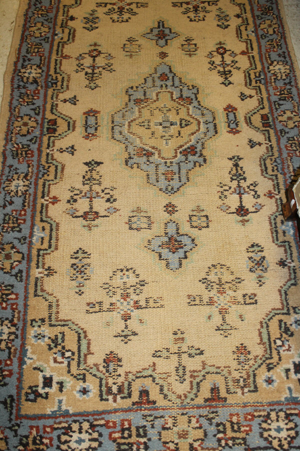 A Caucasian rug, the centre field with repeating hexagonal medallions in terracotta, - Image 3 of 3