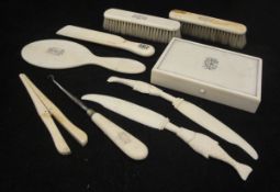 A collection of 19th Century ivory dressing table hairbrushes, mirrors, glove stretcher, boxes,