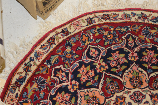 A Persian rug, the central panel set with stylised floral medallion on a red, blue and cream ground, - Image 5 of 34