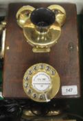 A wall-mounted wooden cased telephone based on the GPO 121 phone with solid brass fittings