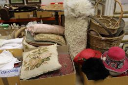 A collection of textiles, cushions, baskets, hats, etc,