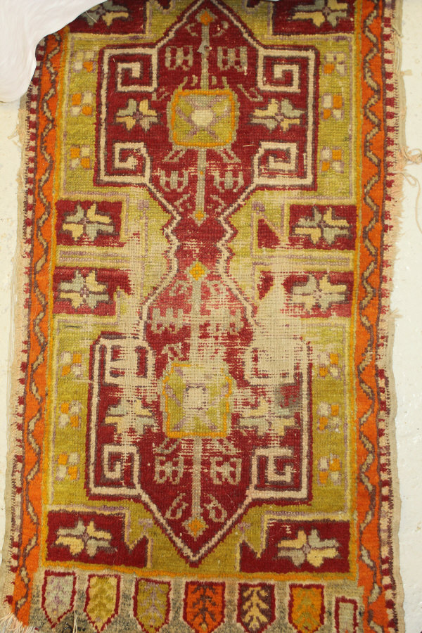 A Caucasian rug, the central panel set with repeating diamond pattern on a neutral ground, - Image 3 of 4