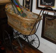 A Victorian wrought iron folding cot on castors,