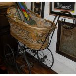 A Victorian wrought iron folding cot on castors,