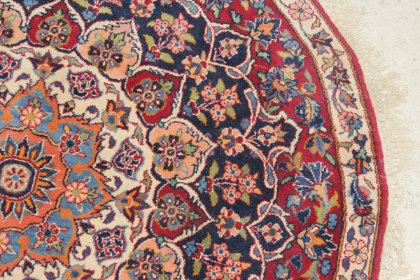 A Persian rug, the central panel set with stylised floral medallion on a red, blue and cream ground, - Image 7 of 34