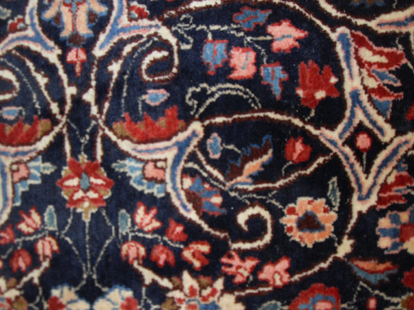 An Eastern rug, the central panel with all over foliate decoration on a midnight blue ground, - Image 3 of 9