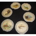 A collection of six early Victorian Torchon lacework and hand-painted place mats, lace trim doilies,
