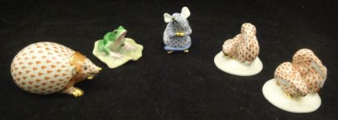 A Herend porcelain hedgehog, two figure groups as pairs of rabbit kittens,