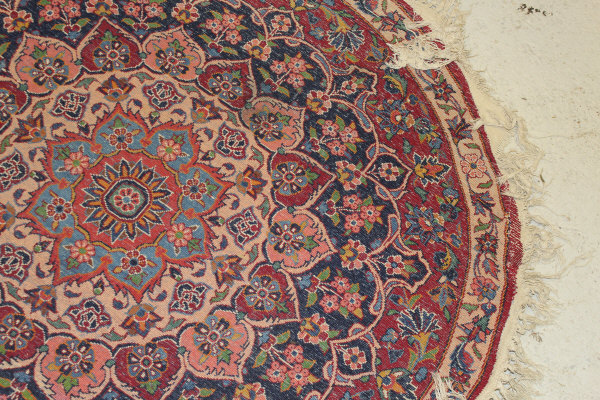 A Persian rug, the central panel set with stylised floral medallion on a red, blue and cream ground, - Image 17 of 34