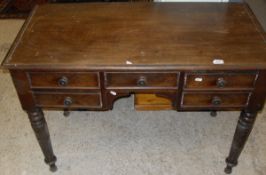 A walnut dressing table with five assorted drawers,