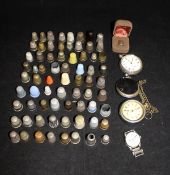 A bag containing assorted thimbles to include silver examples and advertising examples,