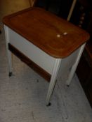 A rectangular side table on square section tapering legs, a cream painted sewing basket,