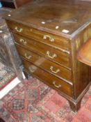 A 19th Century mahogany chest of four long graduated drawers to bracket feet