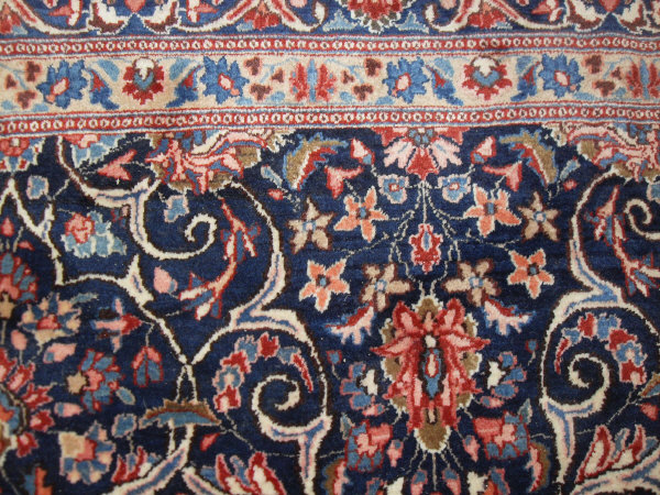 An Eastern rug, the central panel with all over foliate decoration on a midnight blue ground, - Image 5 of 9
