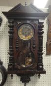 A circa 1900 walnut cased Vienna type regulator wall clock