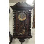 A circa 1900 walnut cased Vienna type regulator wall clock