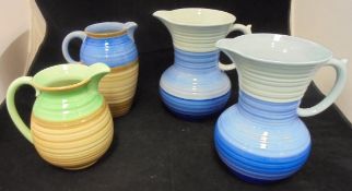 Four Shelley banded ware jugs various