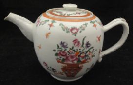 A late 18th / early 19th Century Chinese polychrome decorated teapot with floral spray and vases of