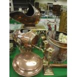 A Victorian brass footman, a Victorian copper coal helmet,