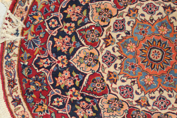 A Persian rug, the central panel set with stylised floral medallion on a red, blue and cream ground, - Image 8 of 34