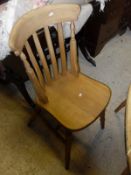 A set of six assorted beech framed slat back kitchen chairs and a similar elbow chair