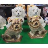 A pair of circa 1900 Staffordshire glazed pottery figures of pugs with glass eyes and two pairs of