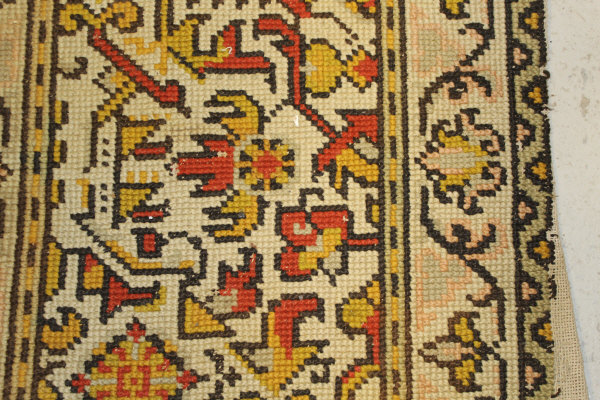 A Persian rug, the central panel set with stylised floral medallion on a red, blue and cream ground, - Image 26 of 34