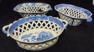 A collection of three various 19th Century blue and white pierced lattice work chestnut dishes