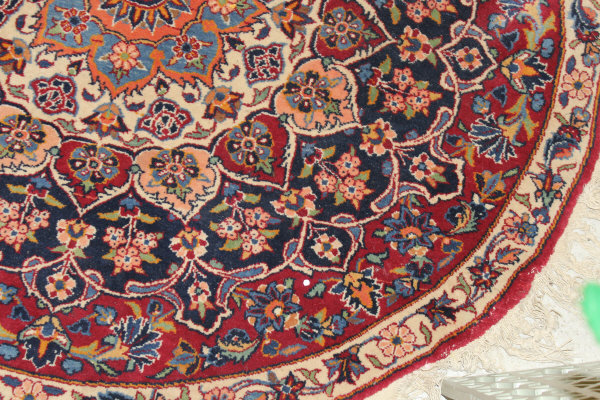 A Persian rug, the central panel set with stylised floral medallion on a red, blue and cream ground, - Image 10 of 34