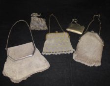 A collection of five plated/white metal and chain mail and other evening purses/bags