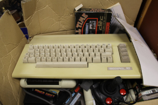 A Commodore 64 with various games to include "A Question of Sport", "Ghostbusters II", "Shooter",