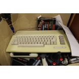 A Commodore 64 with various games to include "A Question of Sport", "Ghostbusters II", "Shooter",