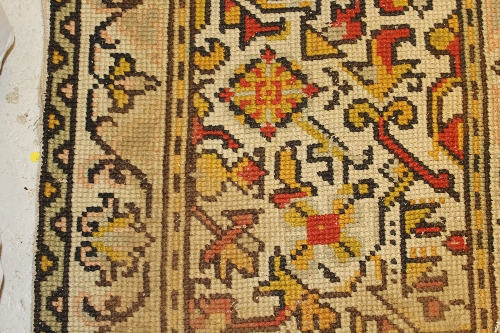 A Persian rug, the central panel set with stylised floral medallion on a red, blue and cream ground, - Image 28 of 34