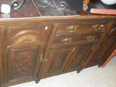 A Victorian mahogany sideboard with two drawers and four cupboard doors with applied moulded panels,