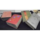 A box containing four early 20th Century postcard albums containing various topographical postcards,