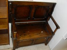 An oak effect open bookcase and an oak Monks type bench CONDITION REPORTS Bookcase