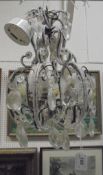 A Continental cut glass and brass wirework three light electrolier