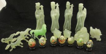 A box containing assorted modern carved jade deity figures,