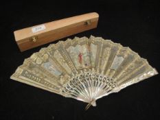 A Victorian mother of pearl and silk fan decorated with figures in 18th Century dress and cherubs,