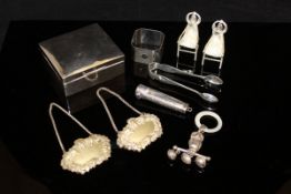 A collection of silver wares comprising a pair of miniature silver chairs,